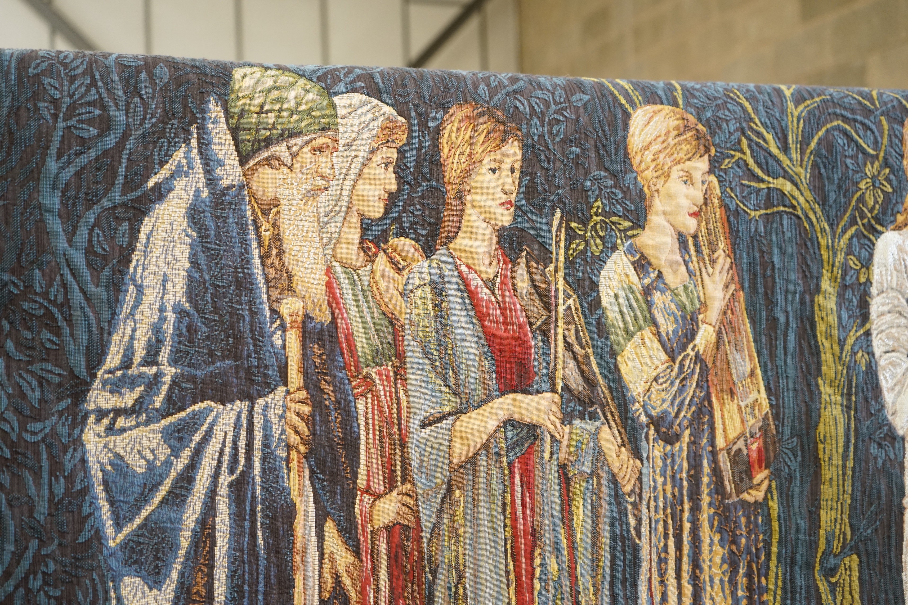 A Hines of Oxford after Burne-Jones a polychrome tapestry panel “Nuptial Procession”, width 188cm, height 122cm